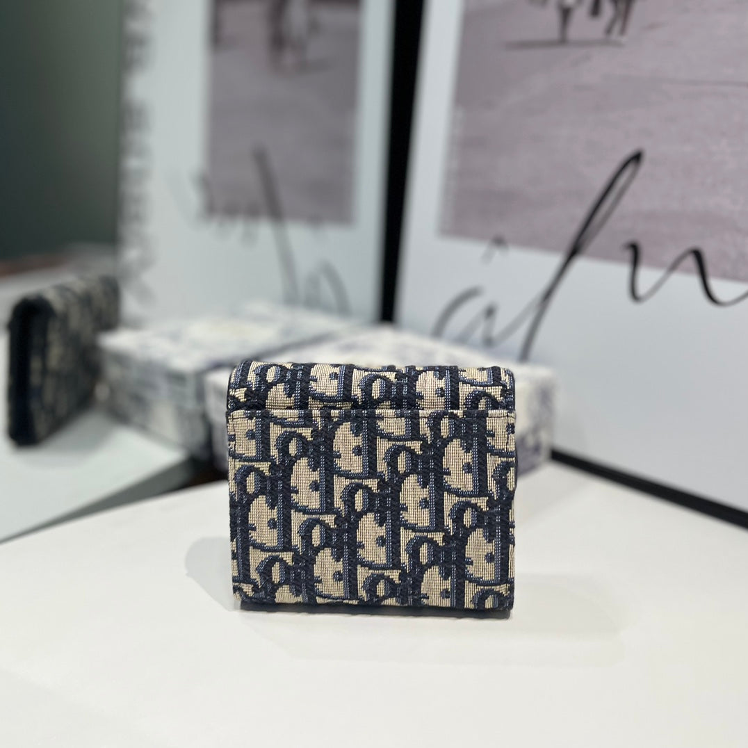 Oblique Lotus Wallet with Asymmetrical Flap & Gold "D" Charm