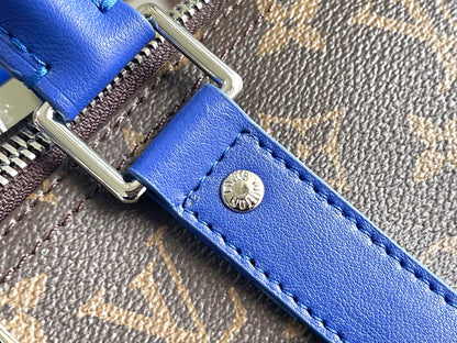 Keepall Bandoulière 50 – Monogram Canvas with Blue Leather Trim